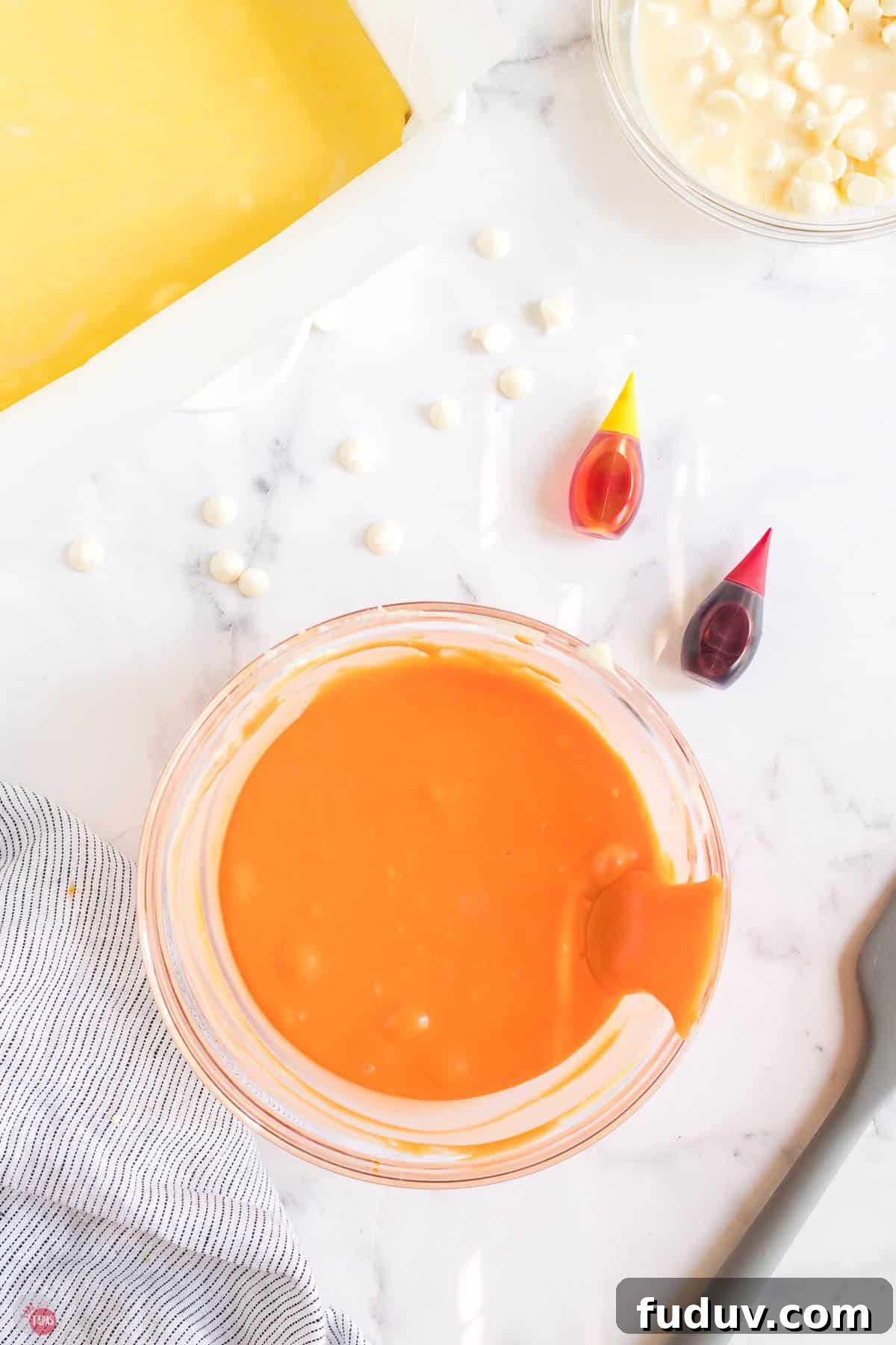 Candy Corn Fudge Recipe: Creamy Halloween Candy Treat 7 bowl of melted white chocolate with orange food coloring