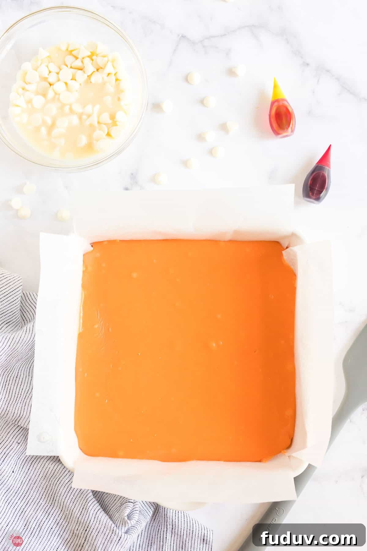 Candy Corn Fudge Recipe: Creamy Halloween Candy Treat 8 square dish with orange fudge in it