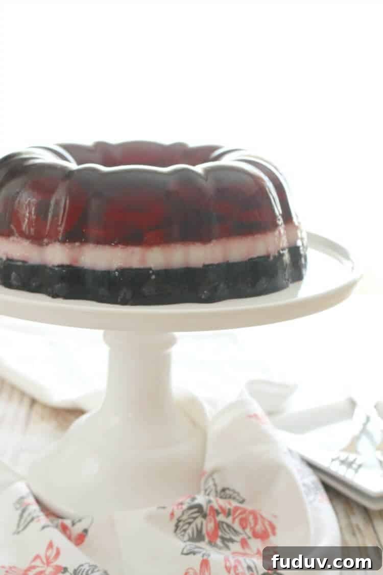 Perfectly layered with seasonal berries, this Real Food Patriotic 'Jello' Cake contains gut-healing gelatin and natural sweetener. This popular summer treat is healthy with simple ingredients. It also happens to be Paleo, Whole30, GAPS diet and even AIP!