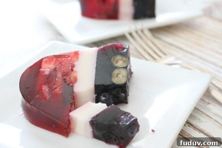 Perfectly layered with seasonal berries, this Real Food Patriotic 'Jello' Cake contains gut-healing gelatin and natural sweetener. This popular summer treat is healthy with simple ingredients. It also happens to be Paleo, GAPS diet and even AIP!