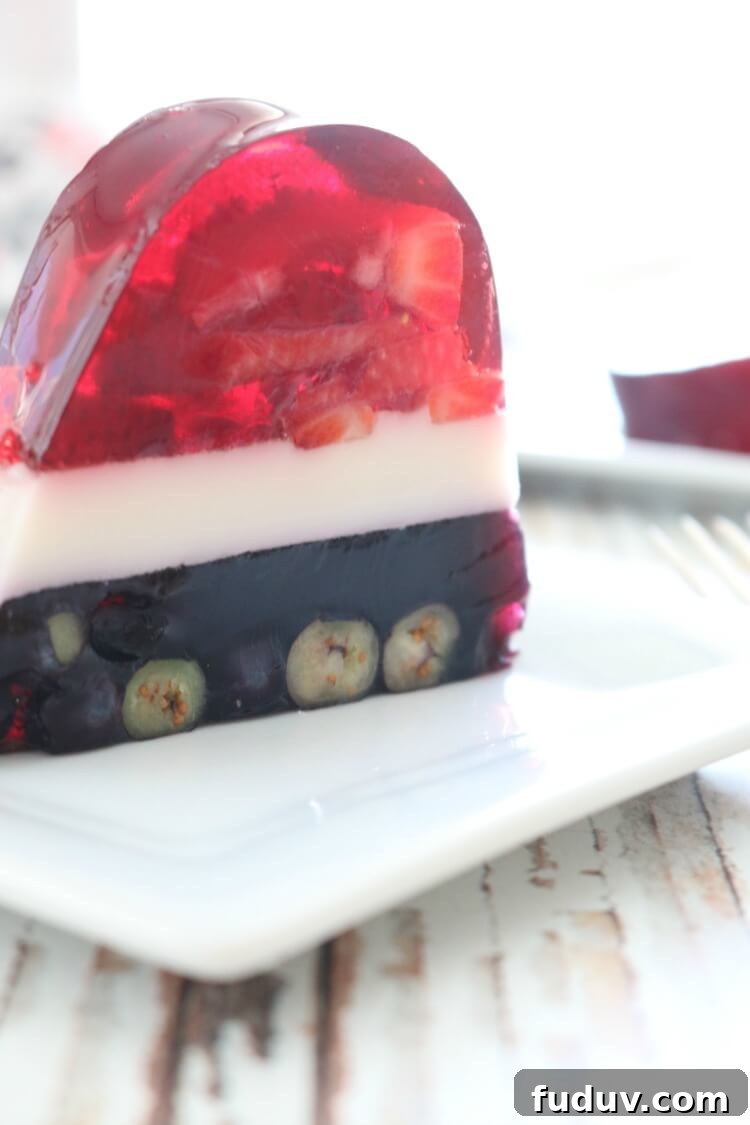 Perfectly layered with seasonal berries, this Real Food Patriotic 'Jello' Cake contains gut-healing gelatin and natural sweetener. This popular summer treat is healthy with simple ingredients. It also happens to be Paleo, GAPS diet and even AIP!