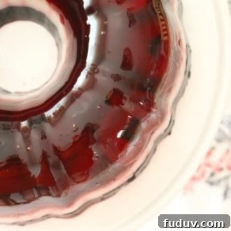 Perfectly layered with seasonal berries, this Real Food Patriotic 'Jello' Cake contains gut-healing gelatin and natural sweetener. This popular summer treat is healthy with simple ingredients. It also happens to be Paleo, Whole30, GAPS diet and even AIP!