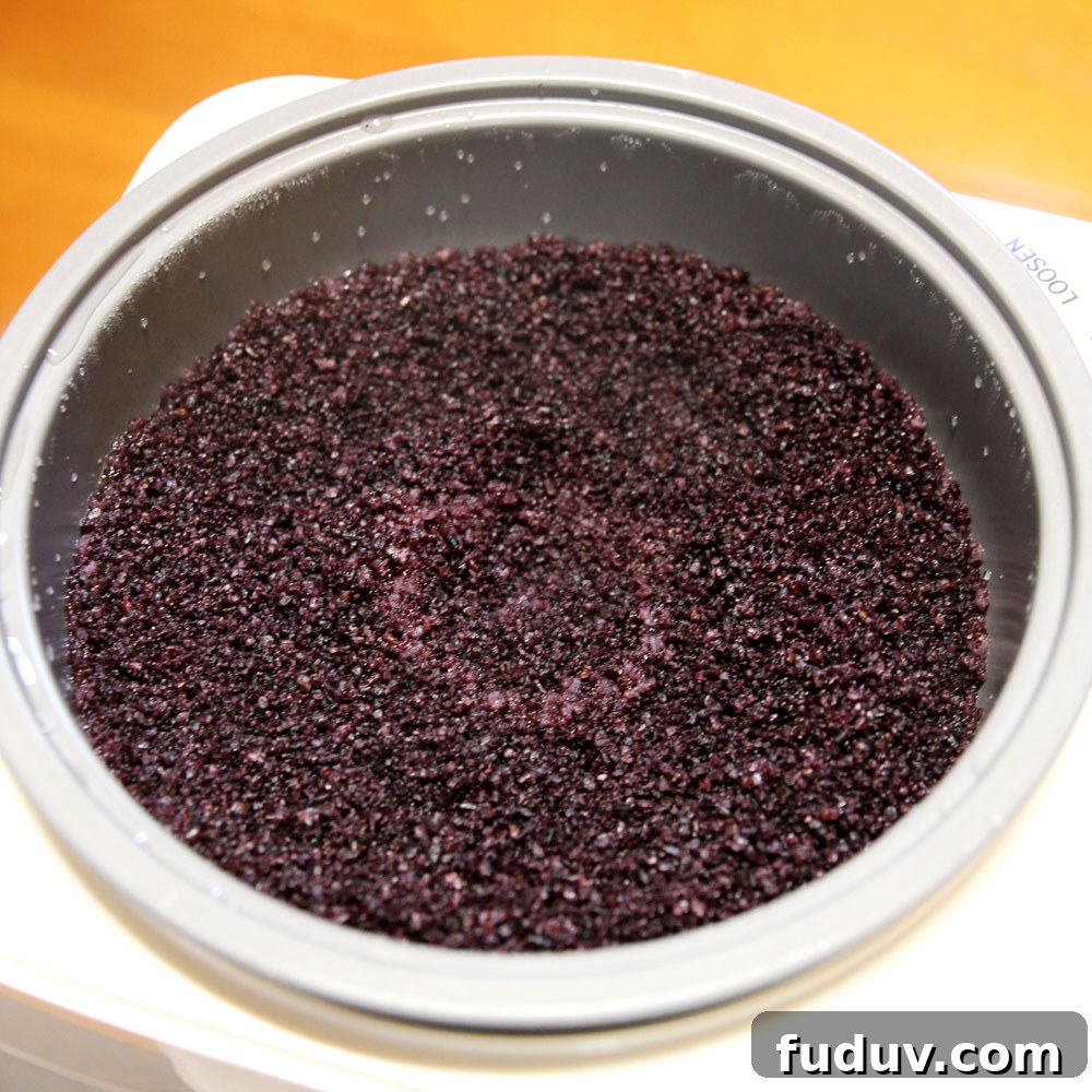 mochi maker will steam and pound the glutinous wild black rice into mochi