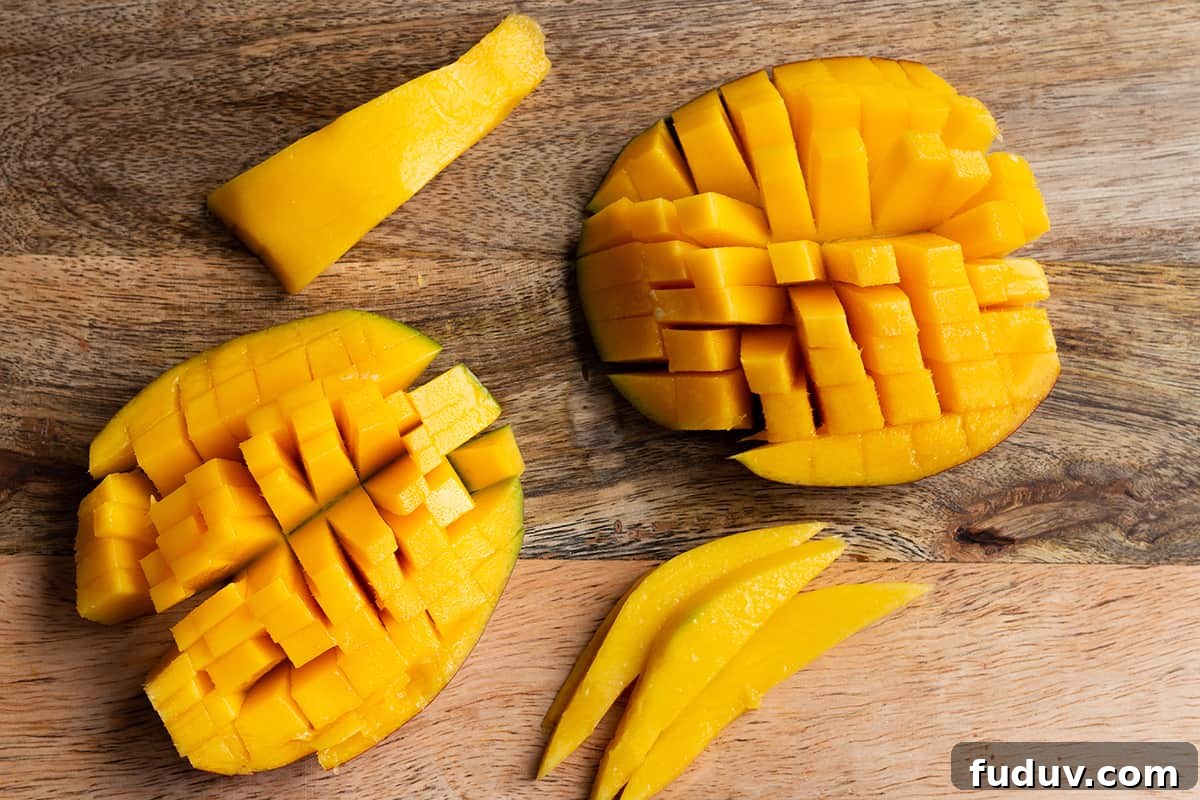 The 4 different pieces of a cut mango.