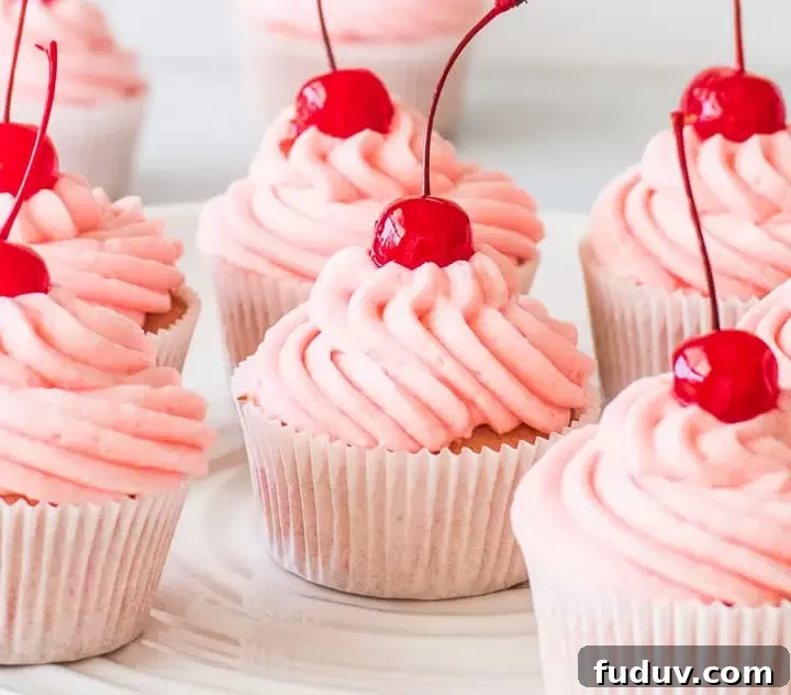 cherry cupcakes on a cake stand