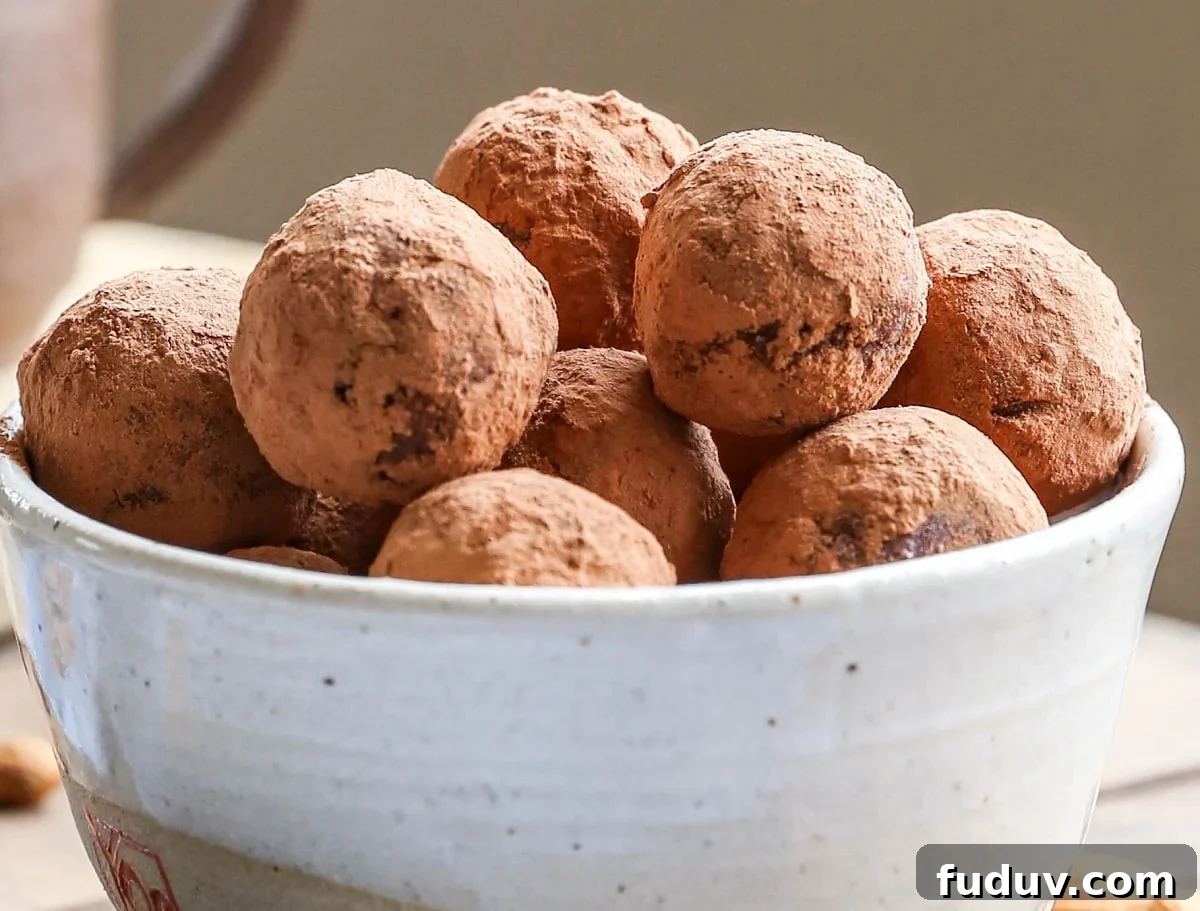 5-Ingredient Chocolate Date Energy Bites for Quick Fuel 5 horizontal image of bowl of chocolate energy bites