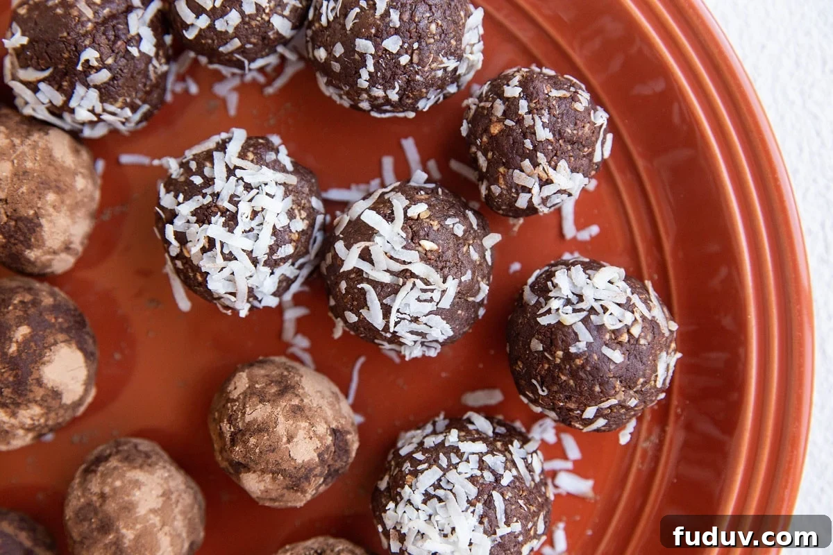 5-Ingredient Chocolate Date Energy Bites for Quick Fuel 9 plate of rolled peanut butter energy balls