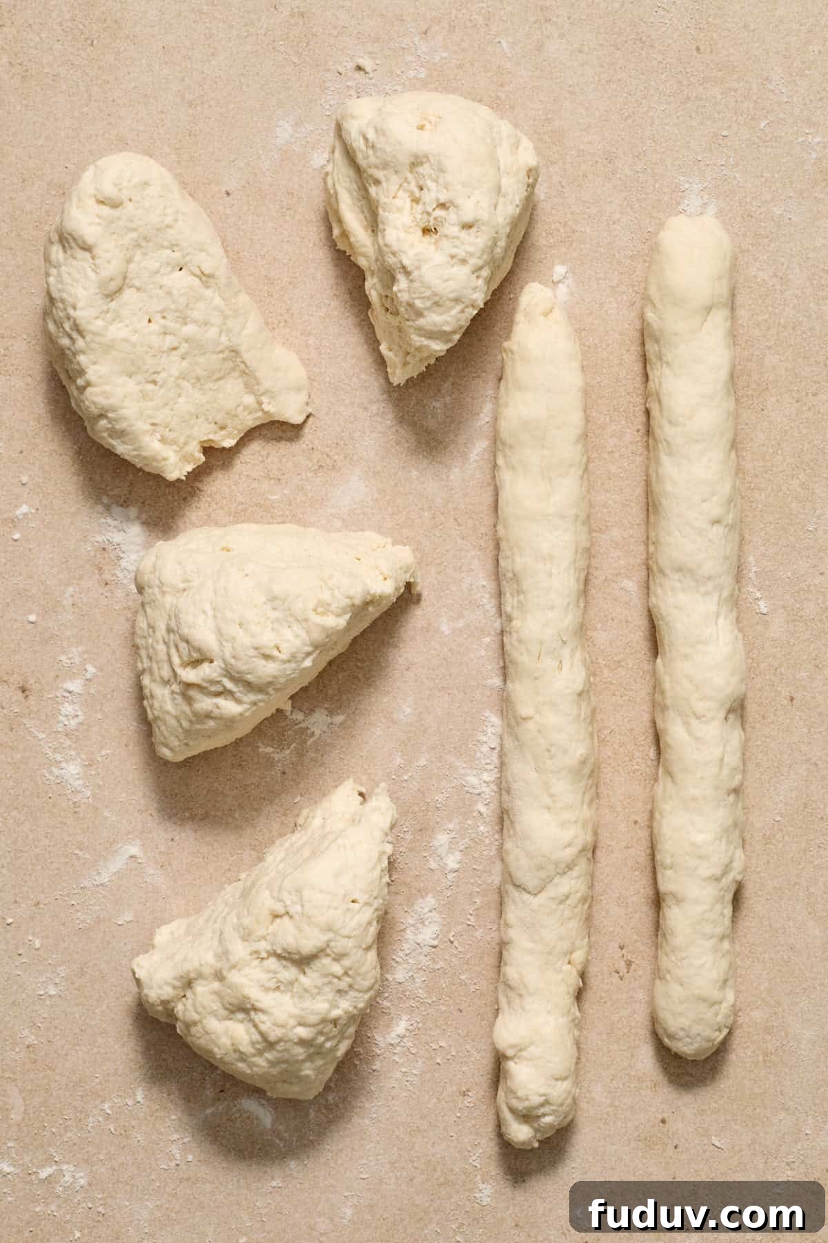 Rolled out dough on floured surface.