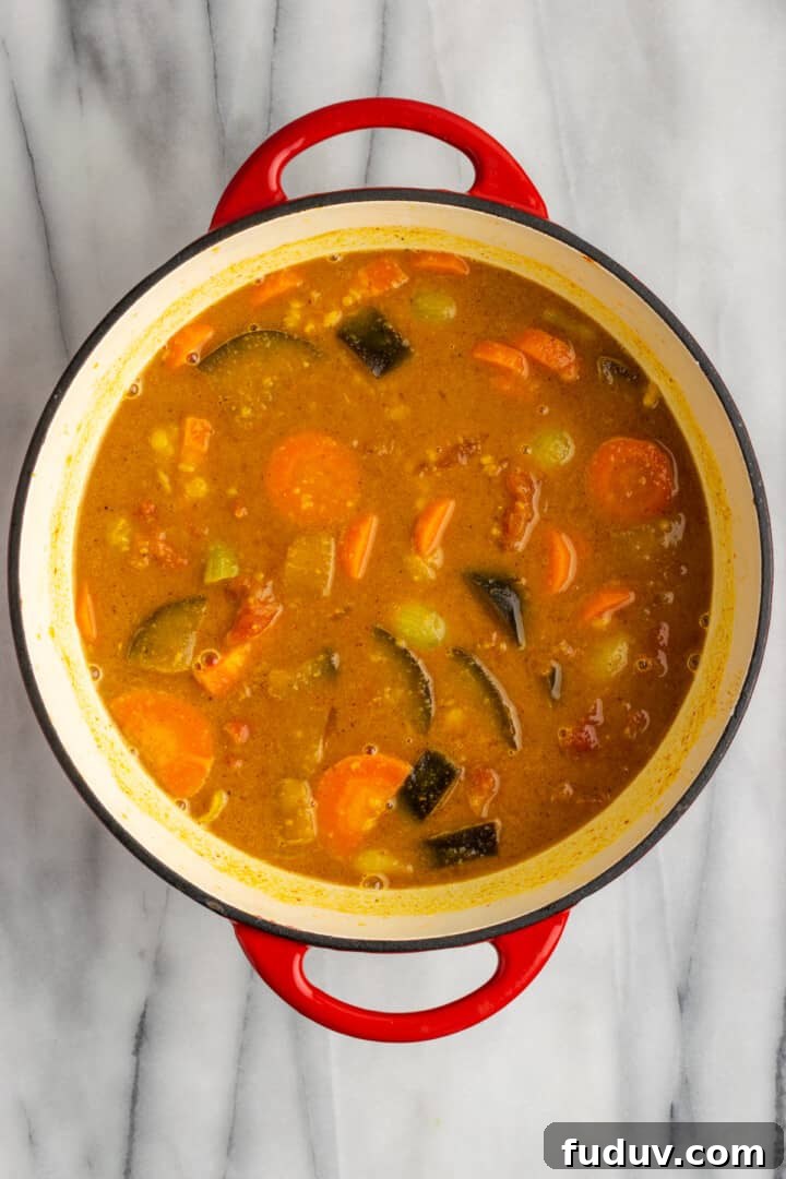 Overhead view of cooked vegan sambar before tempering