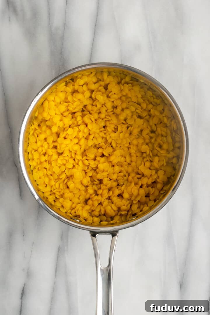 Overhead view of cooked lentils in saucepan