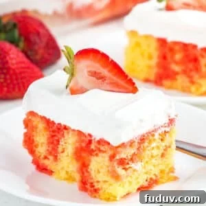 A piece of strawberry jello poke cake with whipped cream frosting on a plate.