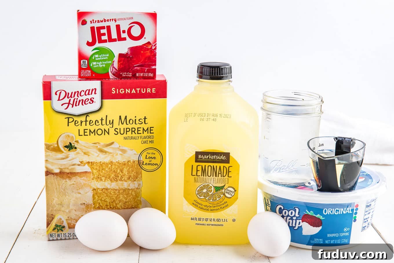 Ingredients on the table to make poke cake with jello.