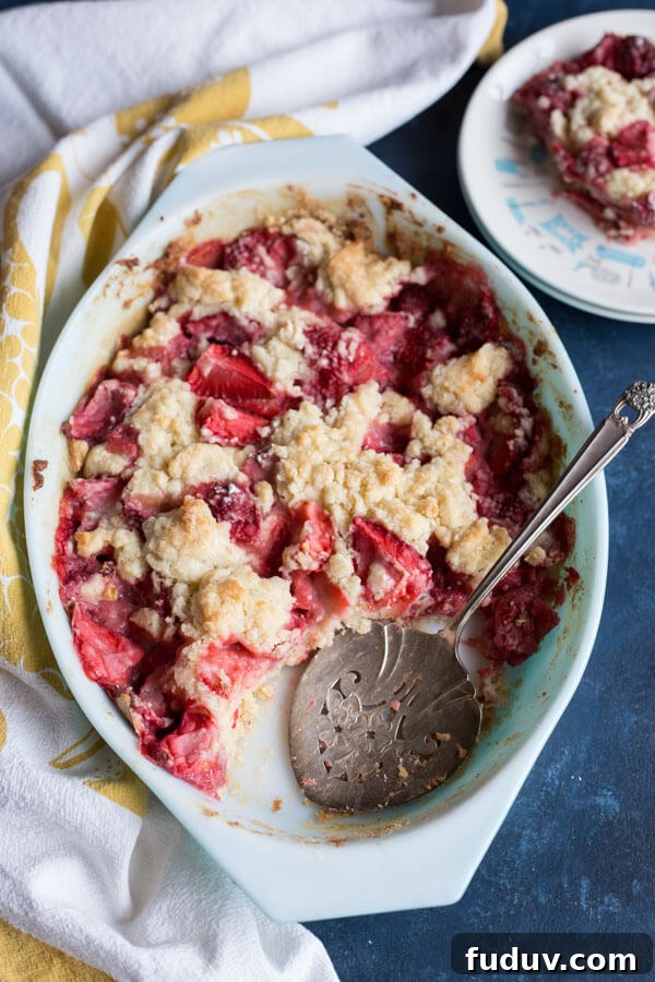 Strawberry dump cake in an oval baking dish