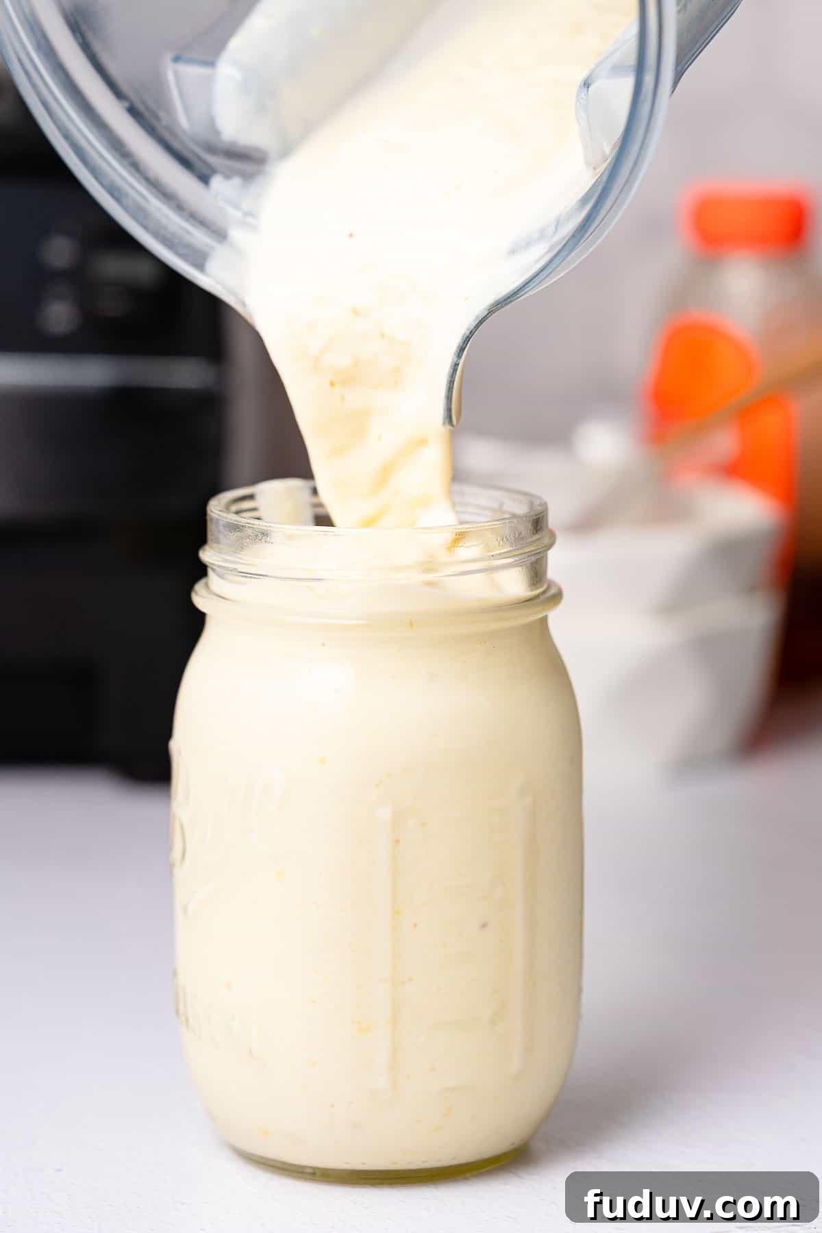 smoothie being poured into a glass