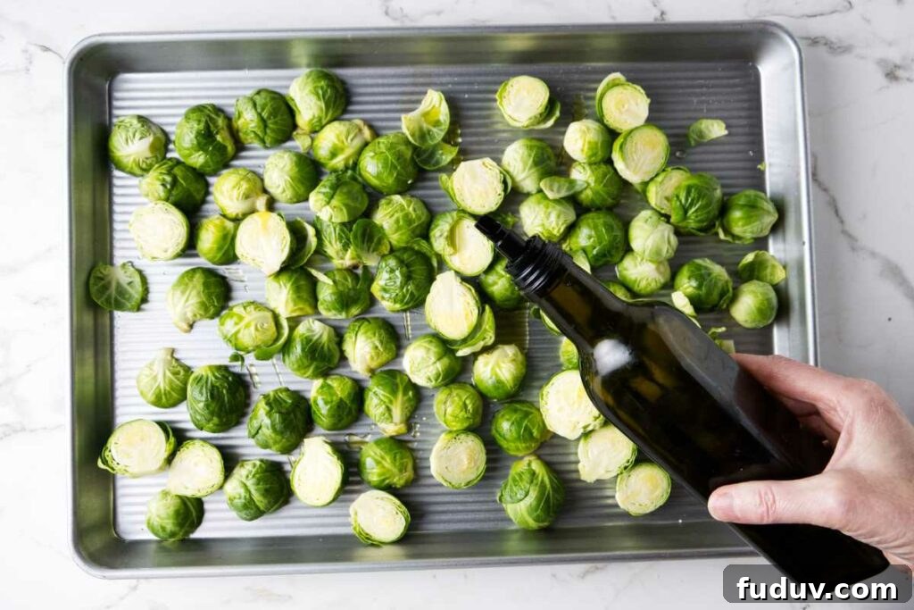 Honey Sriracha Roasted Brussels Sprouts 4 Drizzling olive oil over Brussels sprouts.