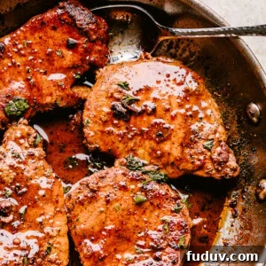 Garlic-Parmesan Pan-Fried Pork Chops with Crispy Golden Crust 2 Skillet with pan fried pork chops