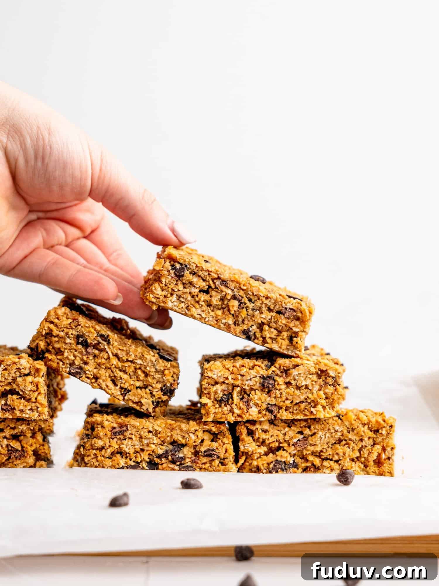 A stack of Chocolate Chip Flapjacks - someone is grabbing one.