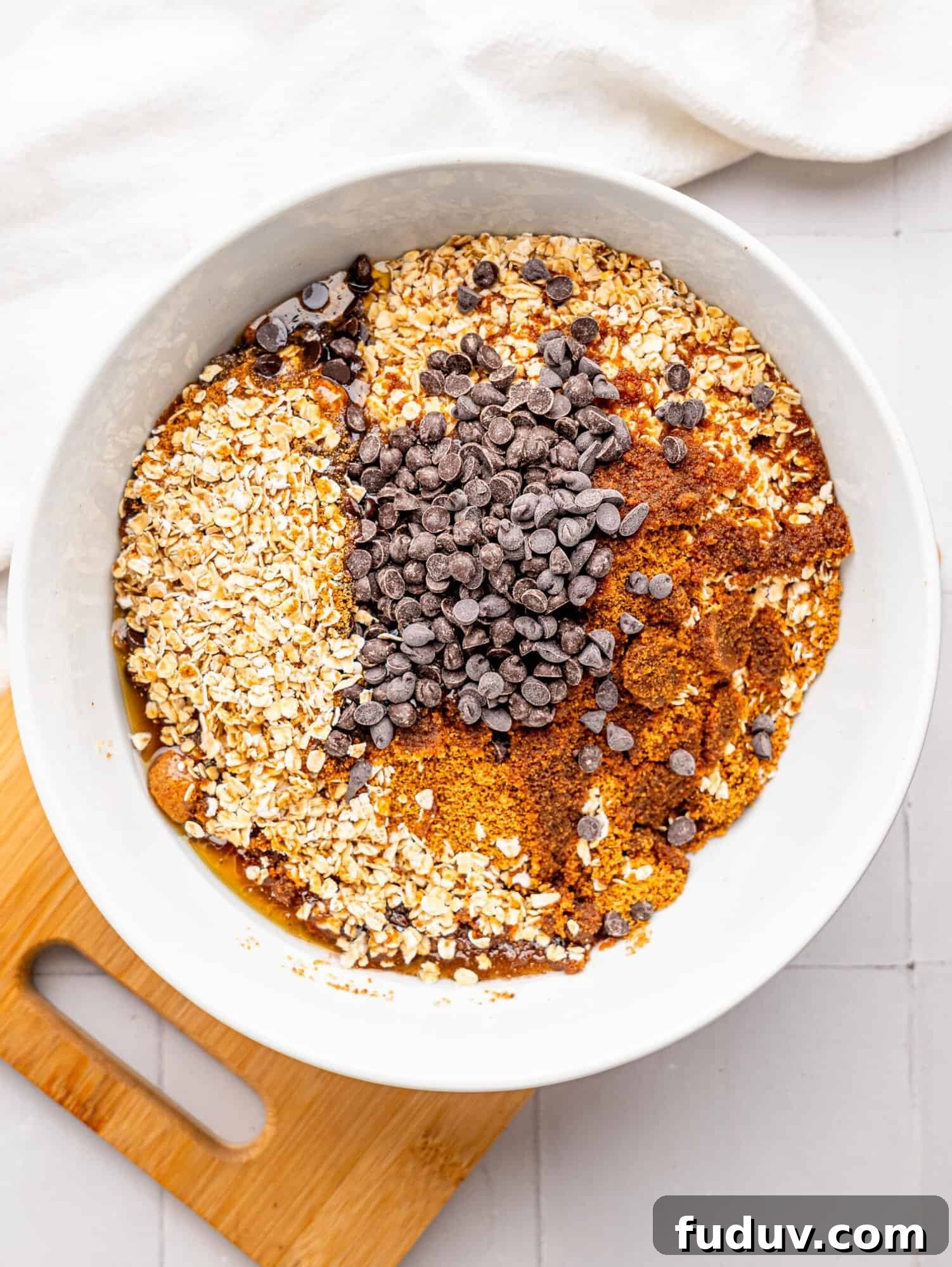 Chocolate chip flapjack mixture in a bowl.