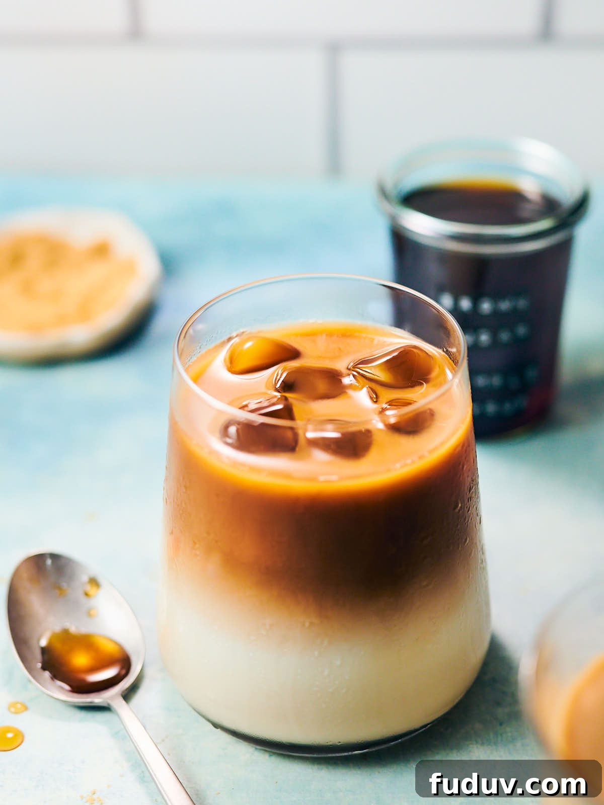 Iced coffee latte in a glass with brown sugar simple syrup.