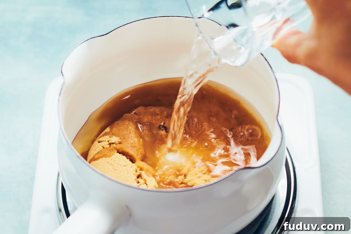 Brown sugar and water in a saucepan to make simple syrup.