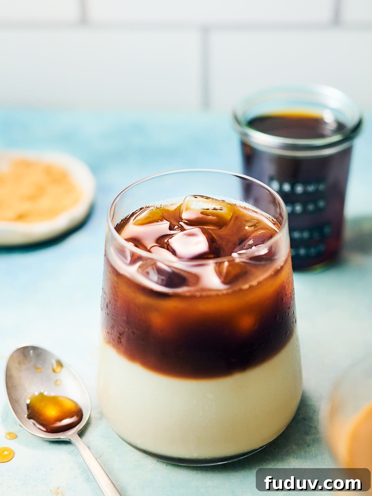 Iced coffee latte in a glass with brown sugar simple syrup.
