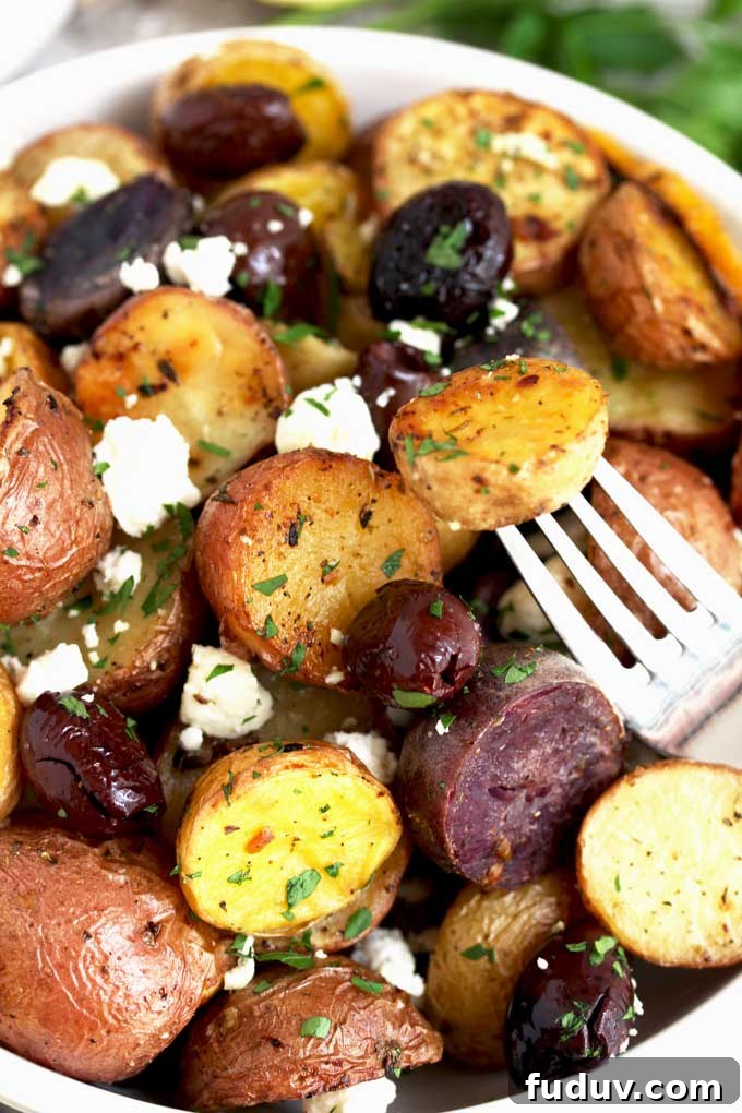 Crispy Greek-Style Roasted Potatoes with Lemon and Oregano 2 A bowl filled with Roasted Greek Potatoes.