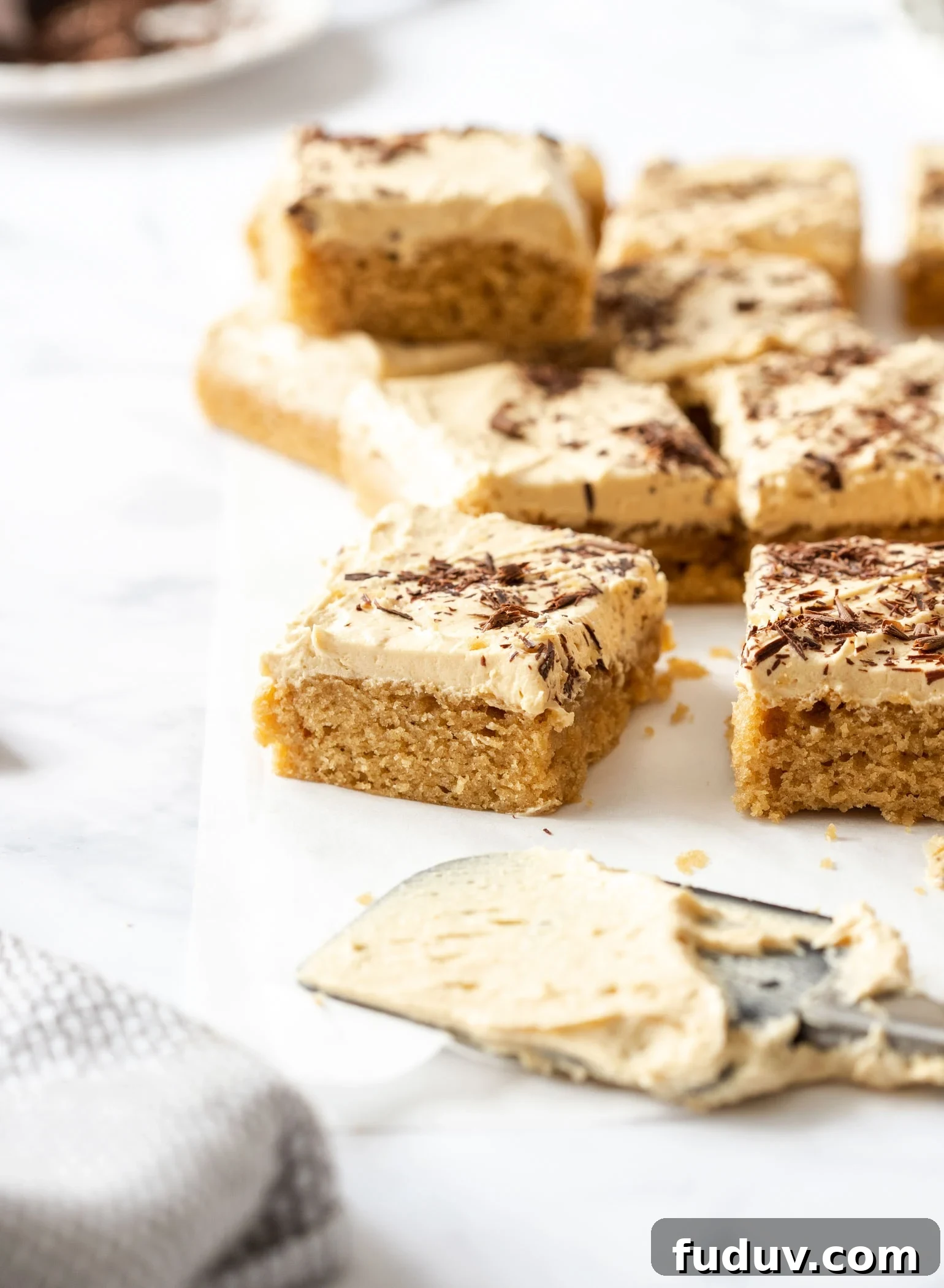 Ultimate Peanut Butter Sheet Cake Recipe for Gatherings 6 slices of peanut butter sheet cake on a sheet of baking paper