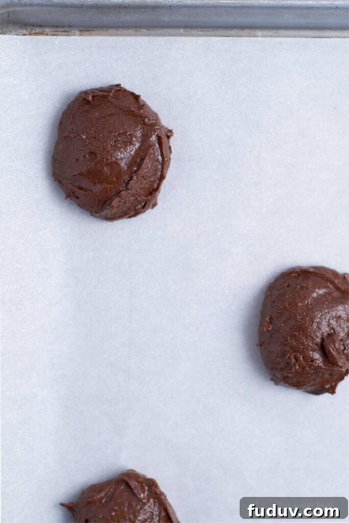 Chewy Brownie Crinkle Cookies Recipe for Fudgy Chocolate Lovers 10 soft brownie cookie dough on parchment lined baking sheet