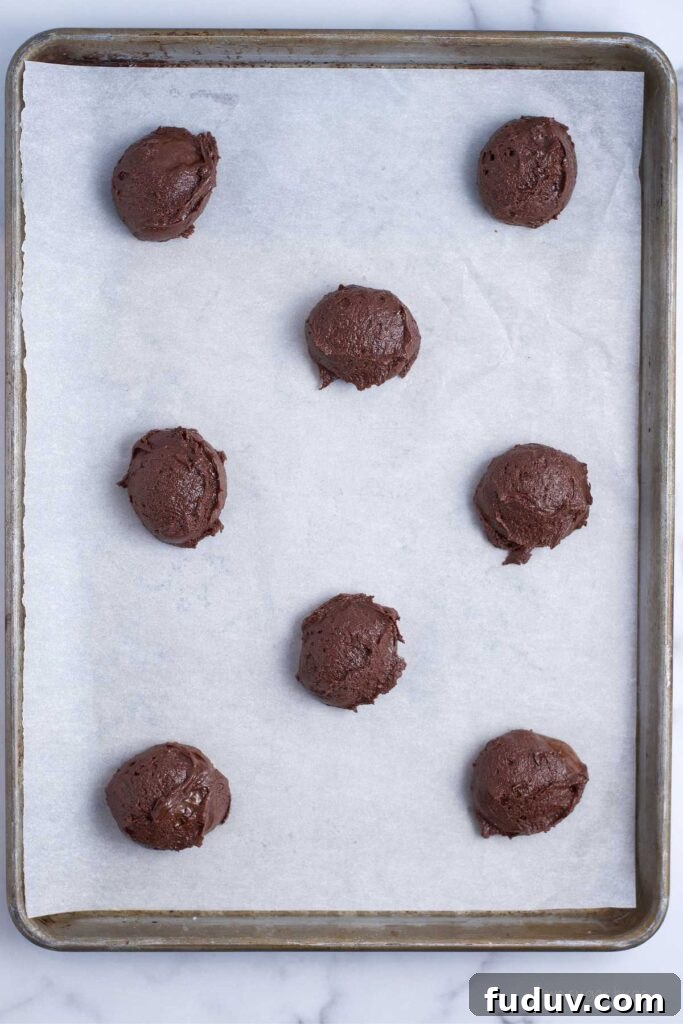 Chewy Brownie Crinkle Cookies Recipe for Fudgy Chocolate Lovers 11 brownie batter cookie dough on baking sheet showing spacing