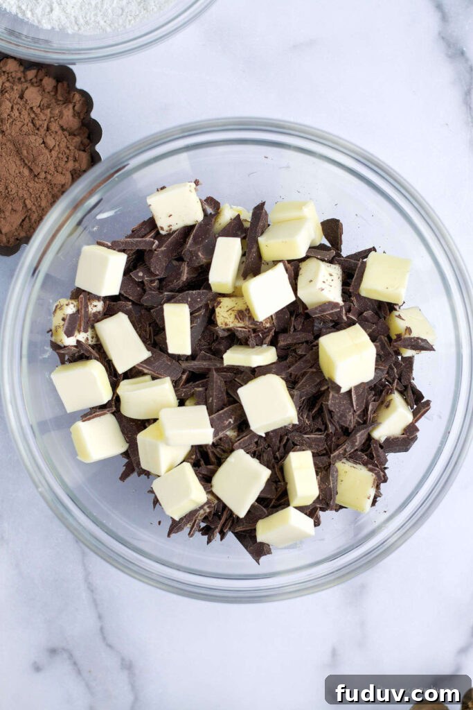 Chewy Brownie Crinkle Cookies Recipe for Fudgy Chocolate Lovers 6 chopped semi sweet chocolate and butter in a glass bowl