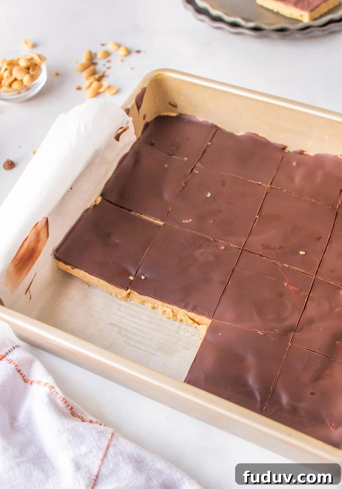 pan of peanut butter bars with a couple of bars cut out