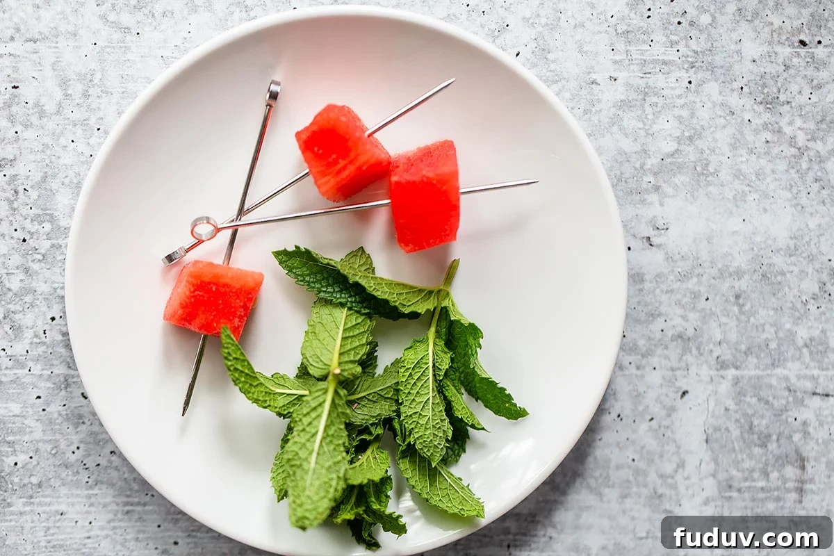 skewered watermelon and mint on a plate