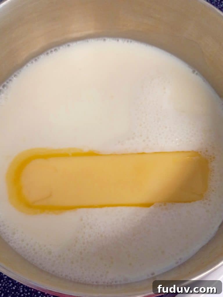 scalded milk with butter in a pan.