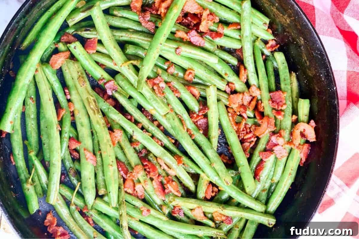 finished green bean side dish with crumbled bacon