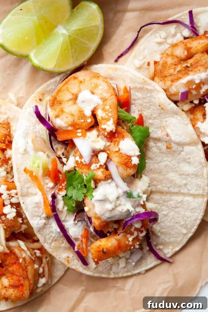 Baja shrimp tacos with cilantro lime cream drizzled on top