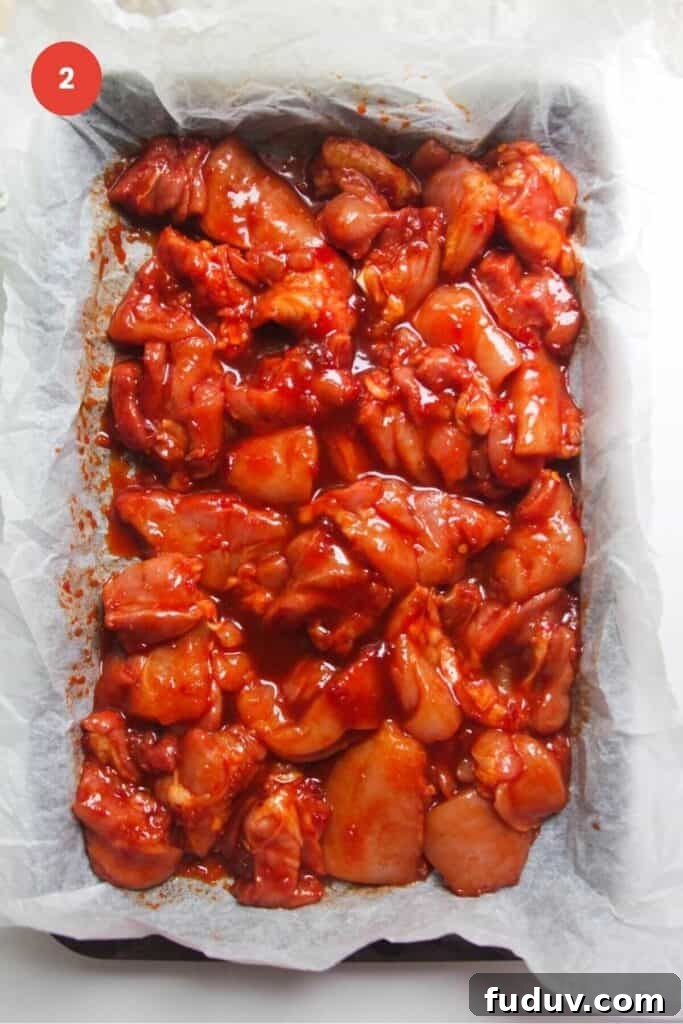 Sticky Gochujang Chicken Recipe: Sweet Spicy Korean Glaze 5 Gochujang marinated chicken arranged in oven tray.