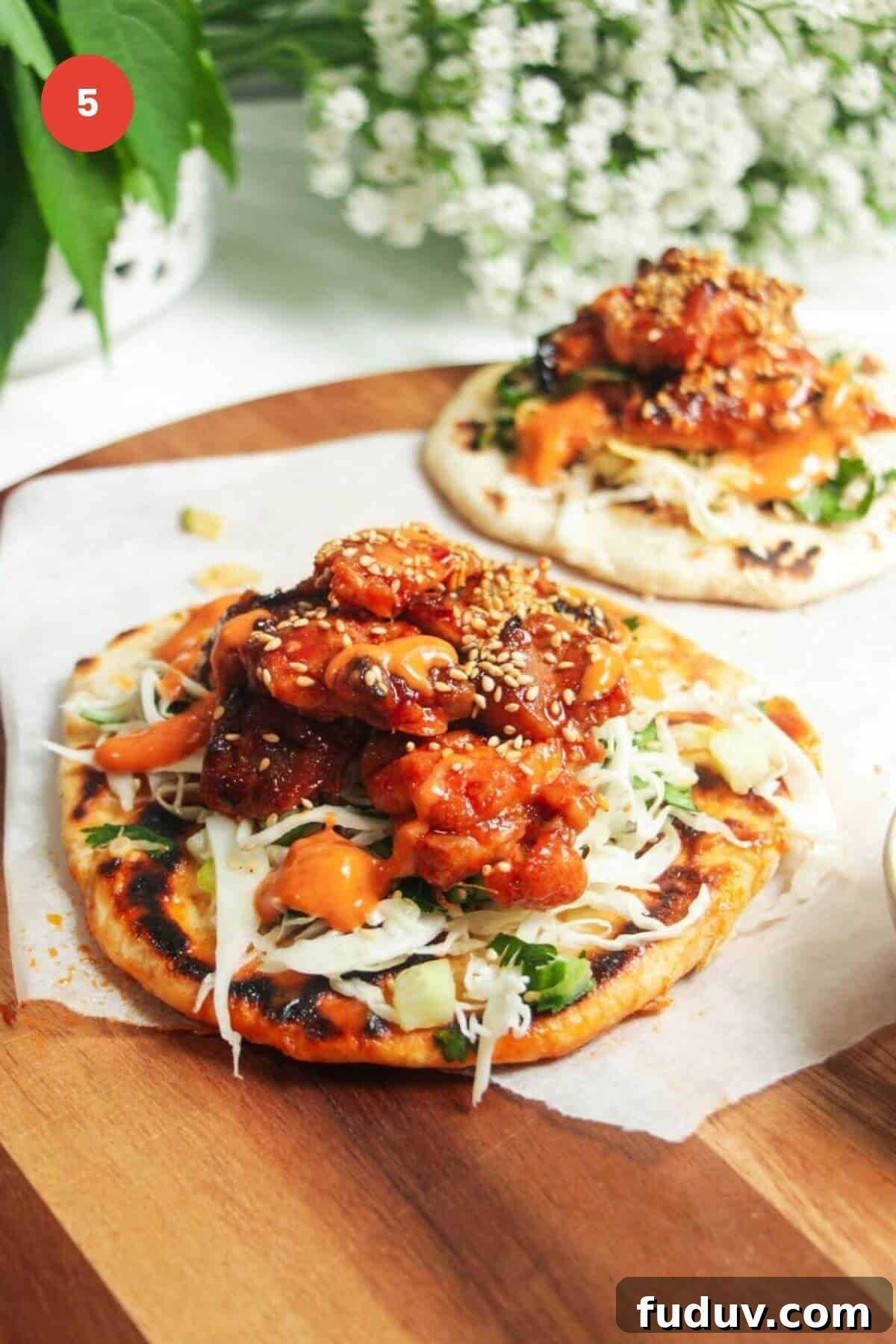 Sticky Gochujang Chicken Recipe: Sweet Spicy Korean Glaze 8 Sticky gochujang chicken on a flatbread.