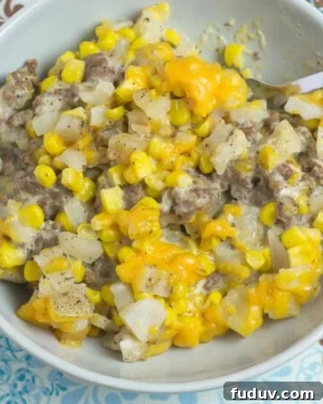 Crock Pot Cowboy Casserole recipe served in a grey bowl