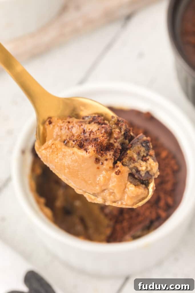 Cappuccino Crème Brûlée with a spoonful removed showing the creamy coffee custard filling