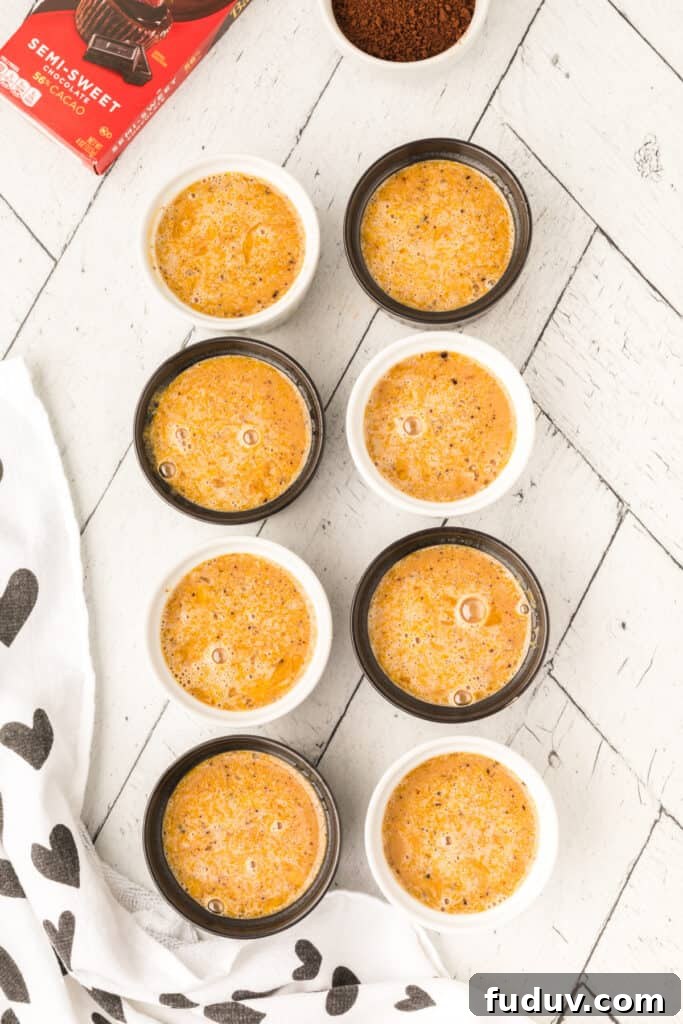 Cappuccino Crème Brûlée custard mixture poured into ramekins before baking