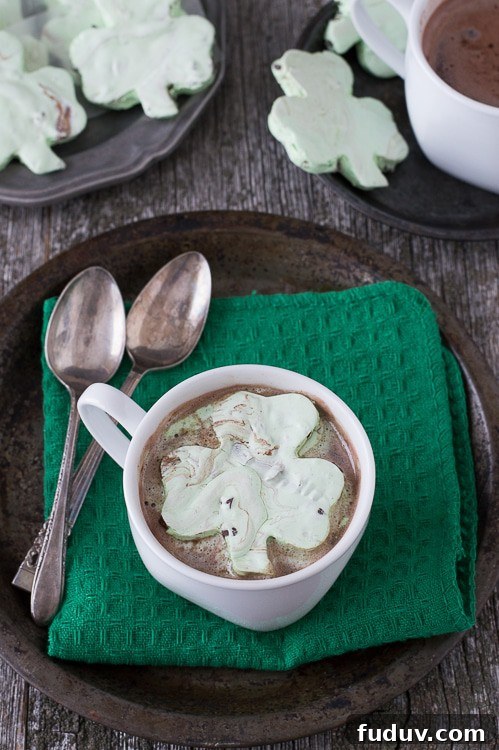 Mint Chocolate Chip Shamrock Marshmallows - a fun homemade marshmallow recipe for St. Patrick’s Day. These are so fun! Mint Chocolate Chip Shamrock Marshmallows in a cup of Hot Cocoa