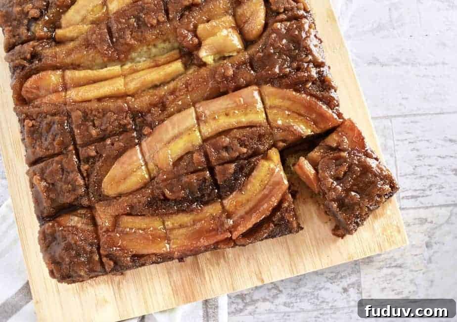 banana upside down cake on wooden board cut into small pieces
