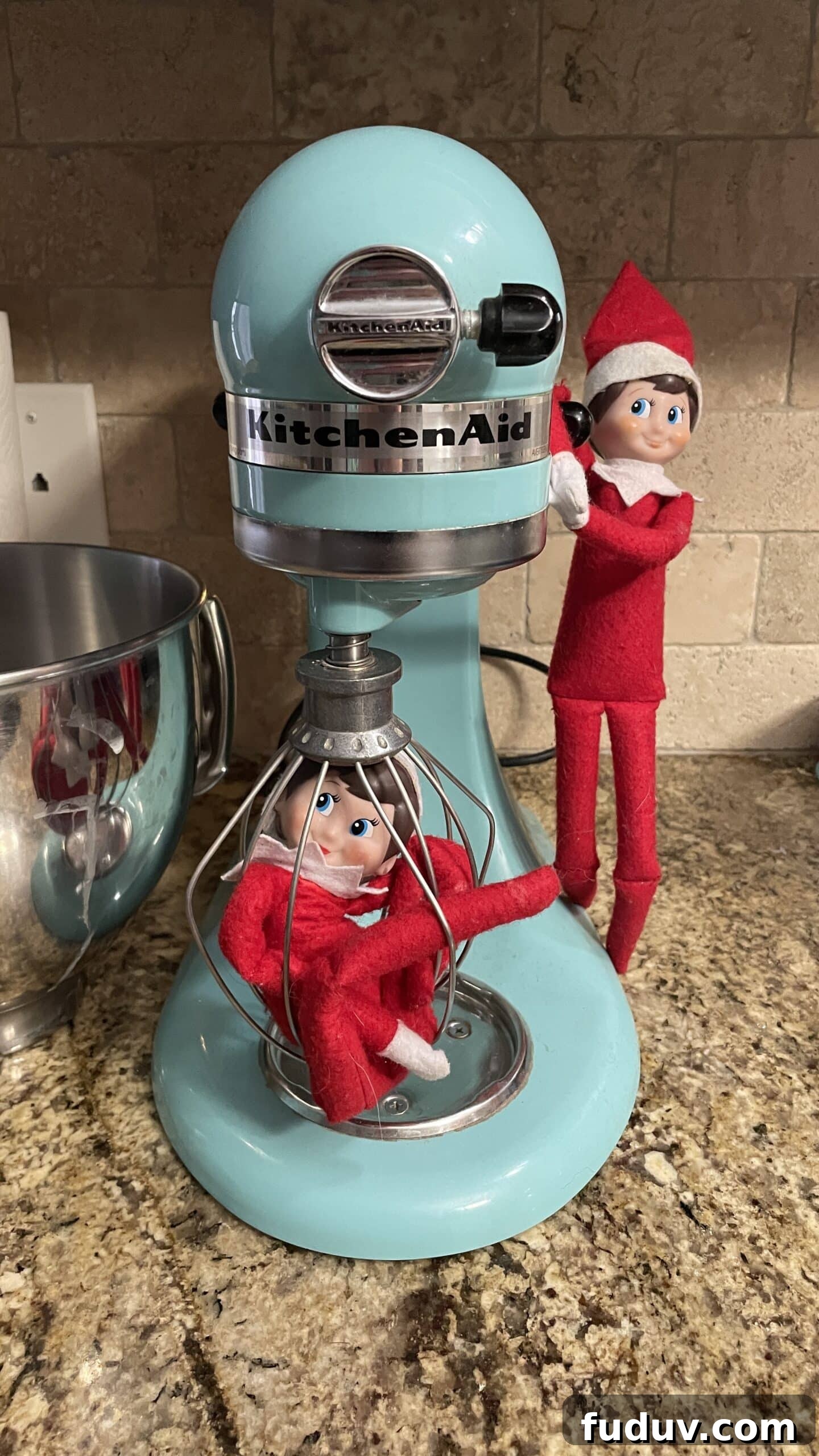 Elf on the Shelf stuck in the whisk of a KitchenAid