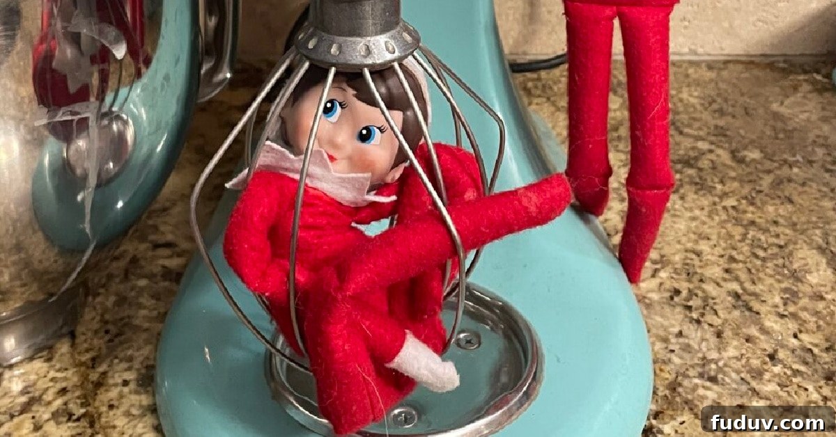Elf on the Shelf stuck in the whisk of a KitchenAid