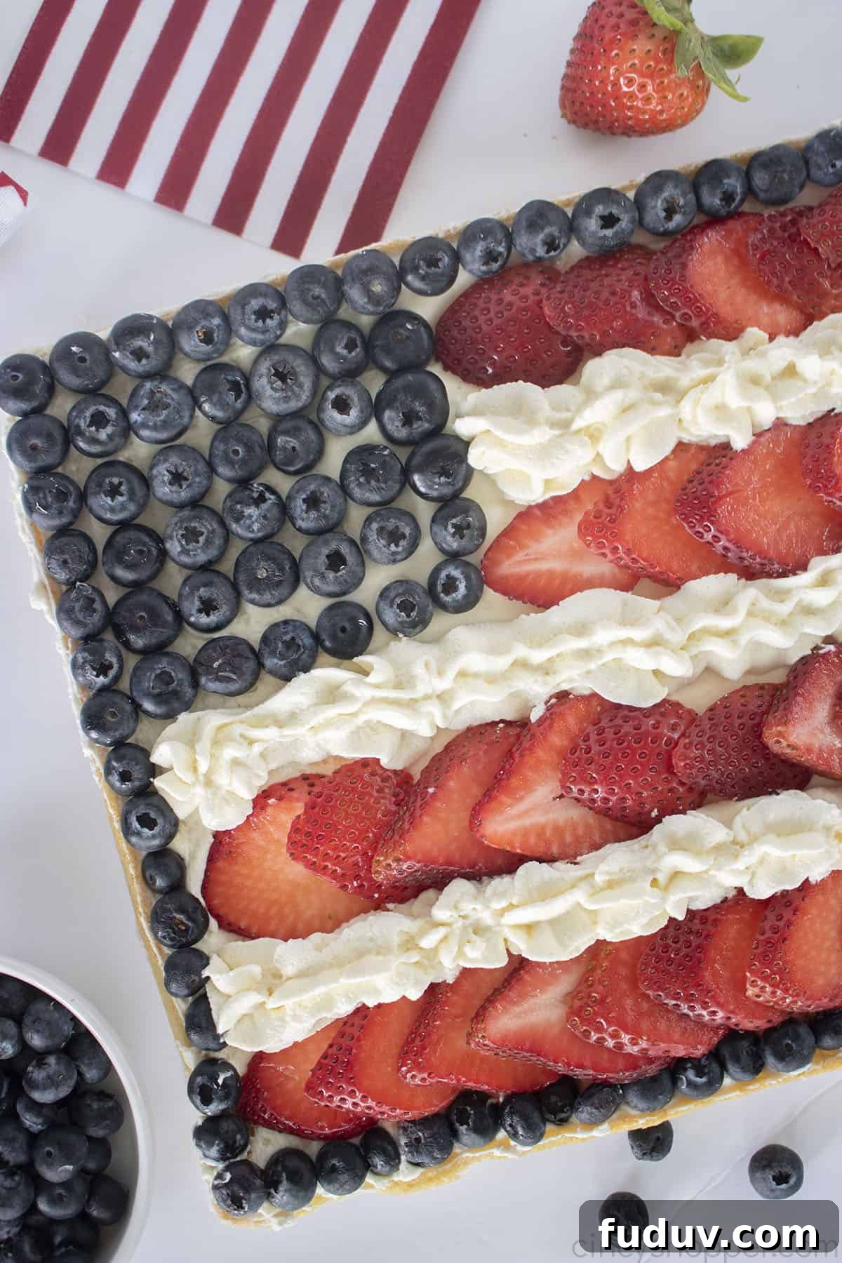 Patriotic Fruit Pizza for 4th of July Celebrations 3 Closeup of blueberries and strawberry dessert cookie.