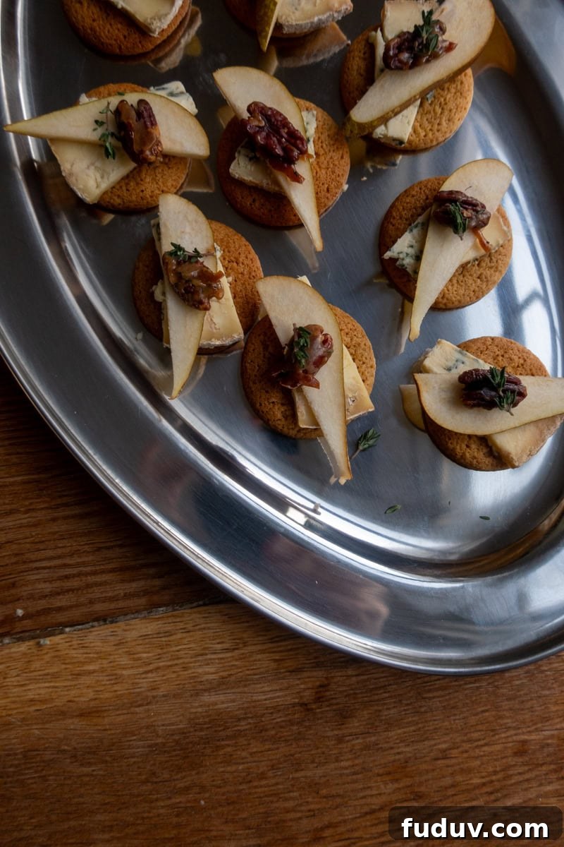 Ginger Nut Canapés with Stilton and Pear 5 Ginger biscuits with stilton, pear and candied pecans - Georgie Mullen