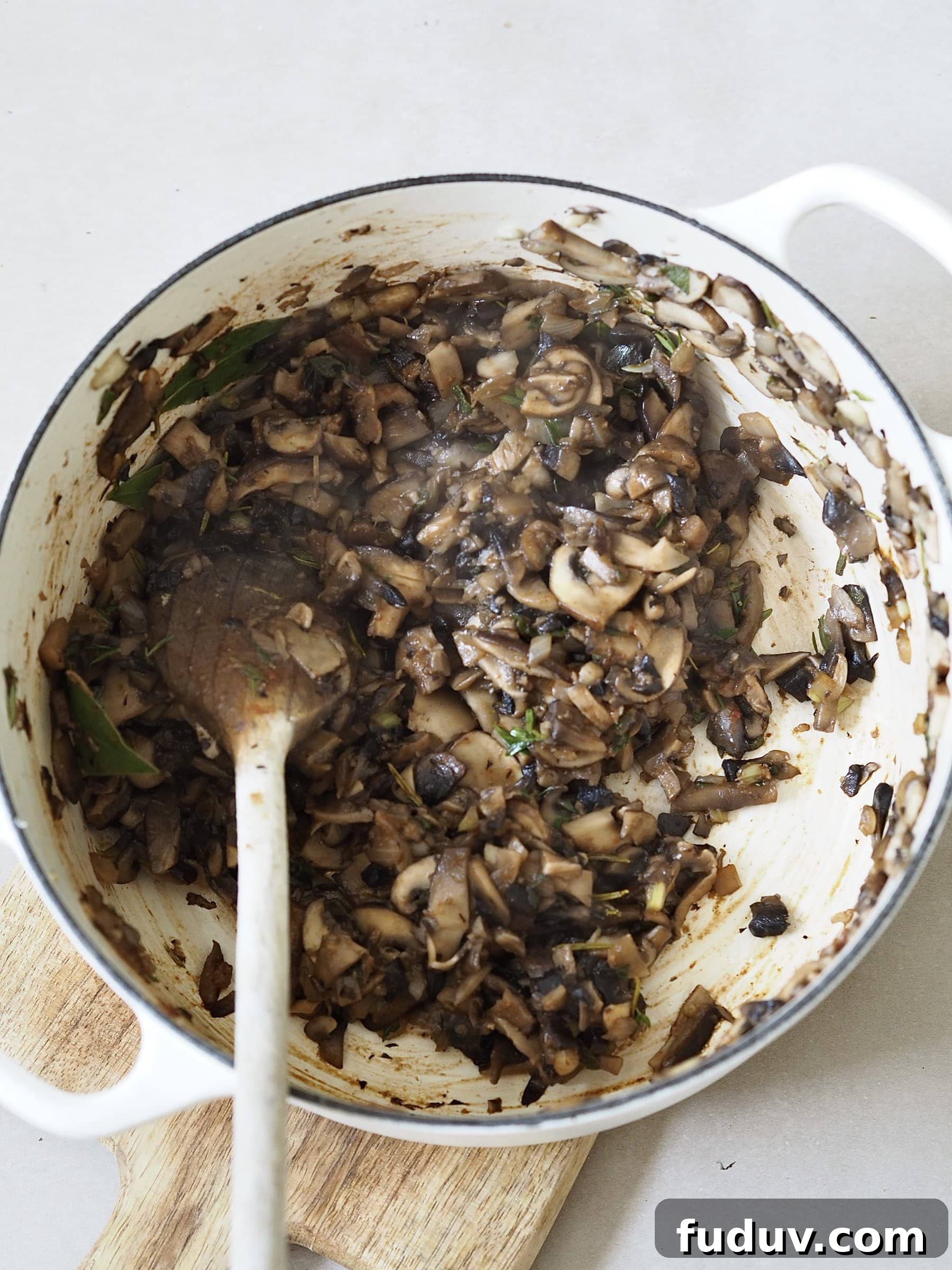 Frying mushrooms in a pot